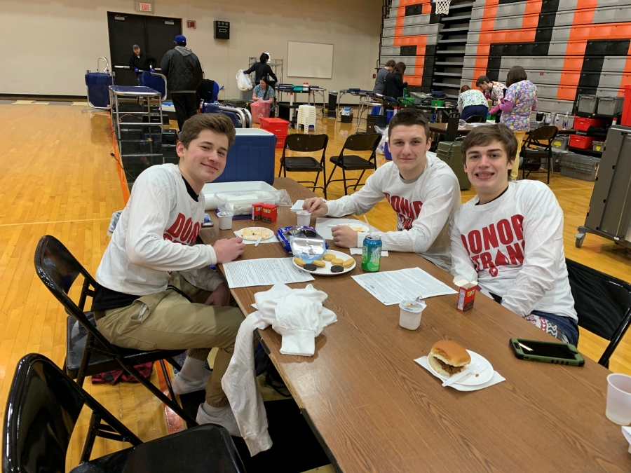three boys at a table